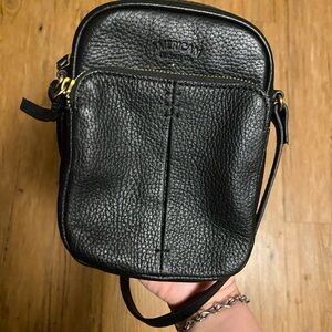 Small black crossbody purse.